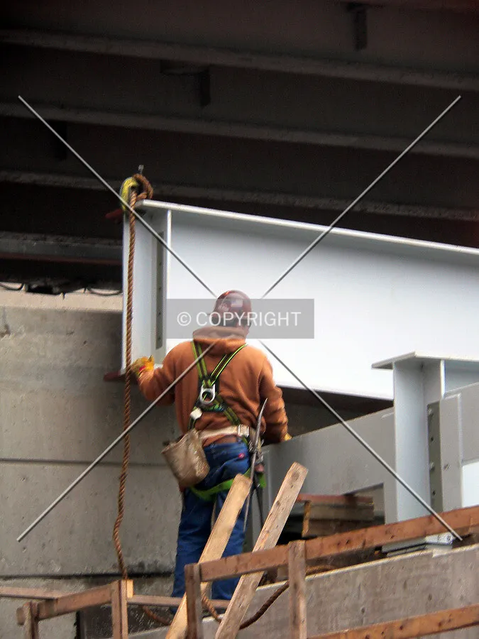 Guiding a piece of steel into place for the southbound exit ramp from lower Lake Shore Drive