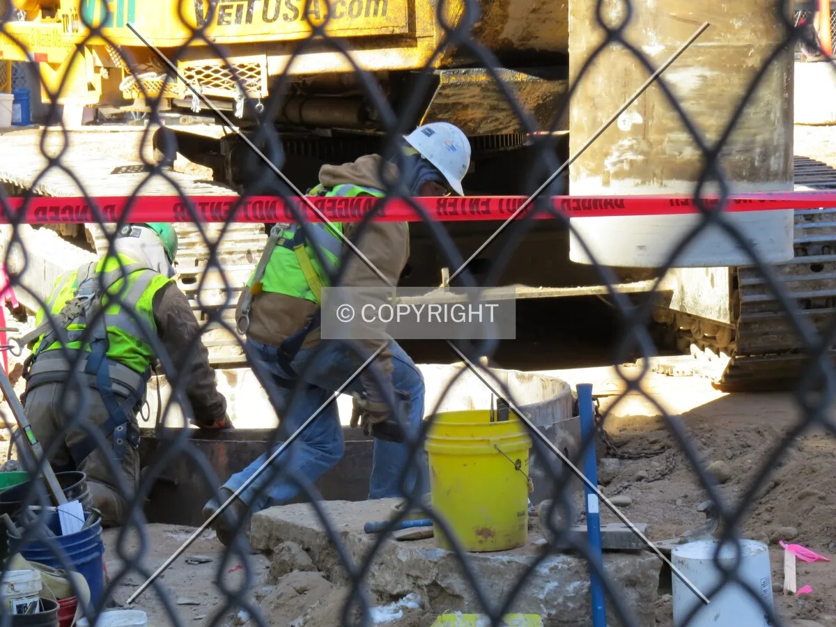 Workers assisting with foundations