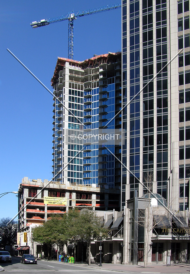 From the east rising behind 201 North Tryon