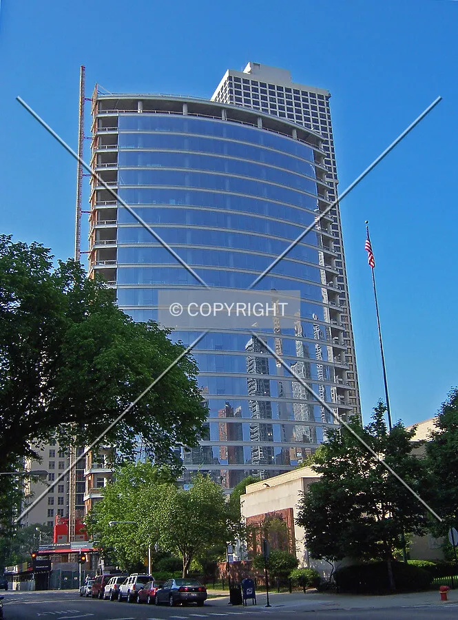 View from the south; the reflective glass is producing a mirror image of the surrounding buildings