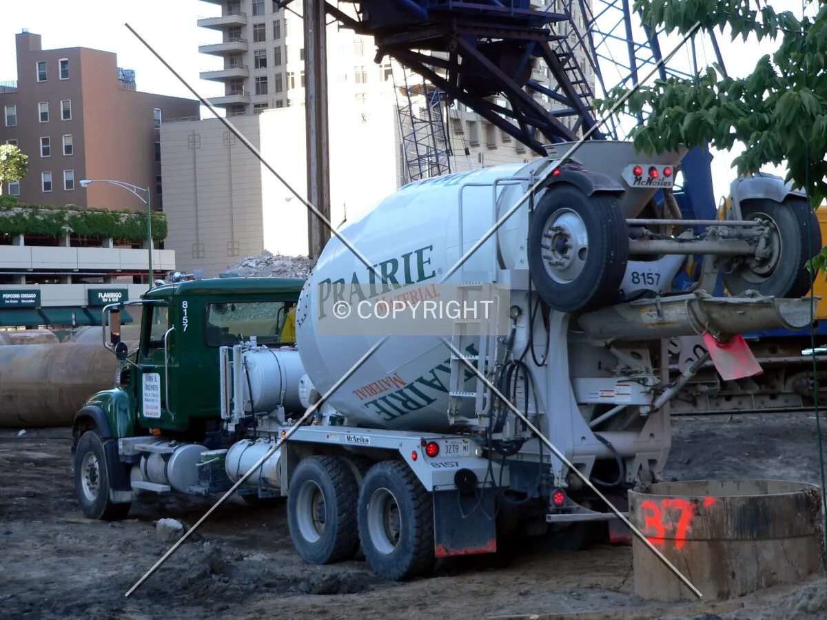 A concrete truck near a caisson hole