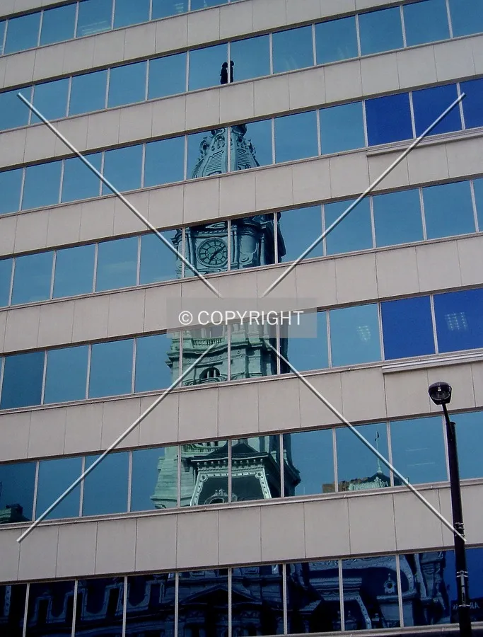 City Hall's tower in the reflective facade