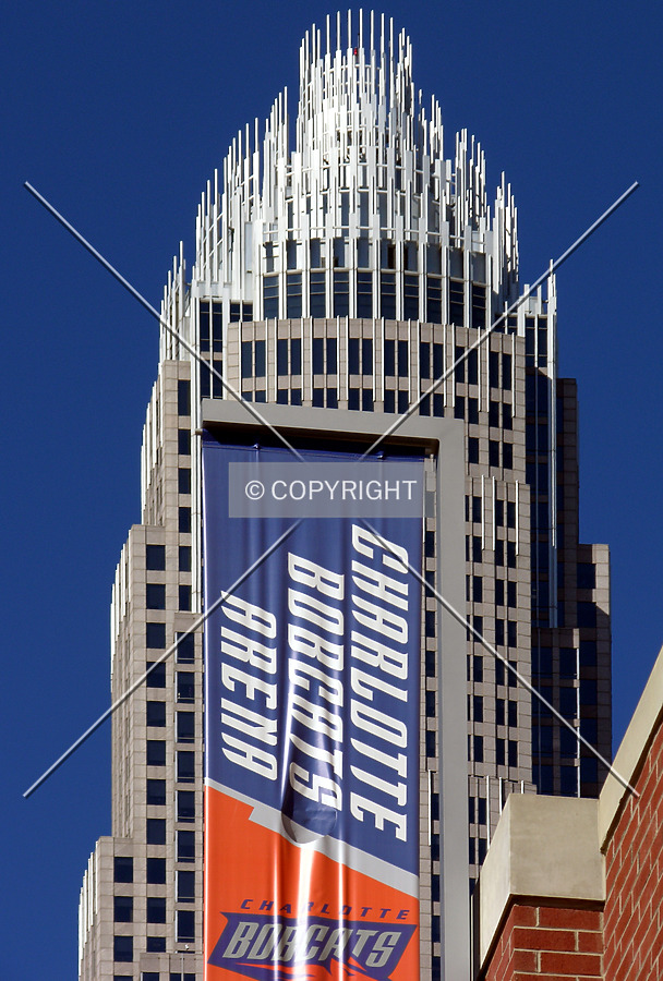 Signage with the Bank of America Corporate Center looming