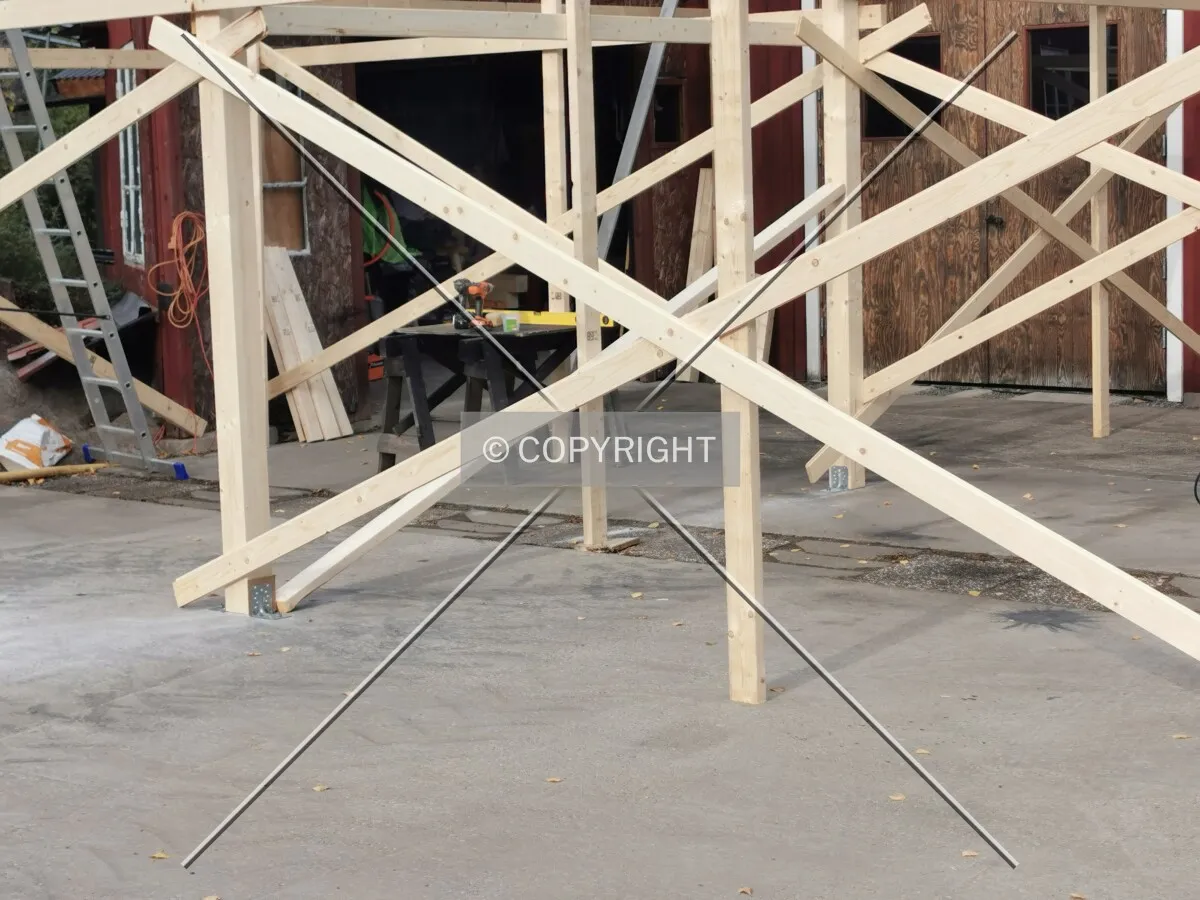 A shed is constructed on a plain surface