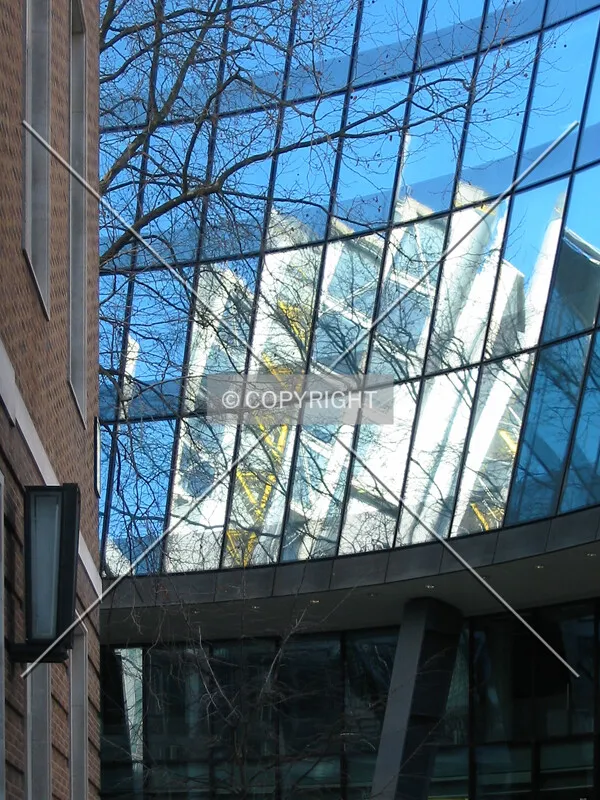 Richard Roger's 88 Wood Street is reflected in the rear facade