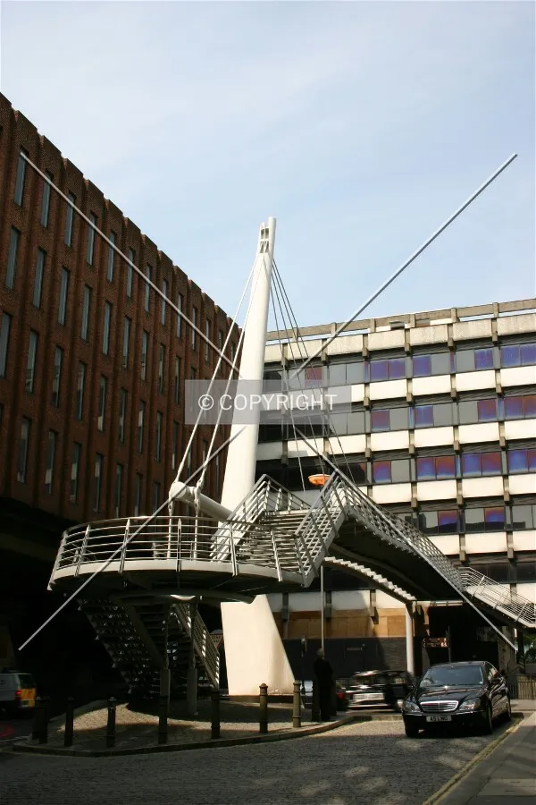 A cable-stayed walkway traverses the City's Upper Thames Street