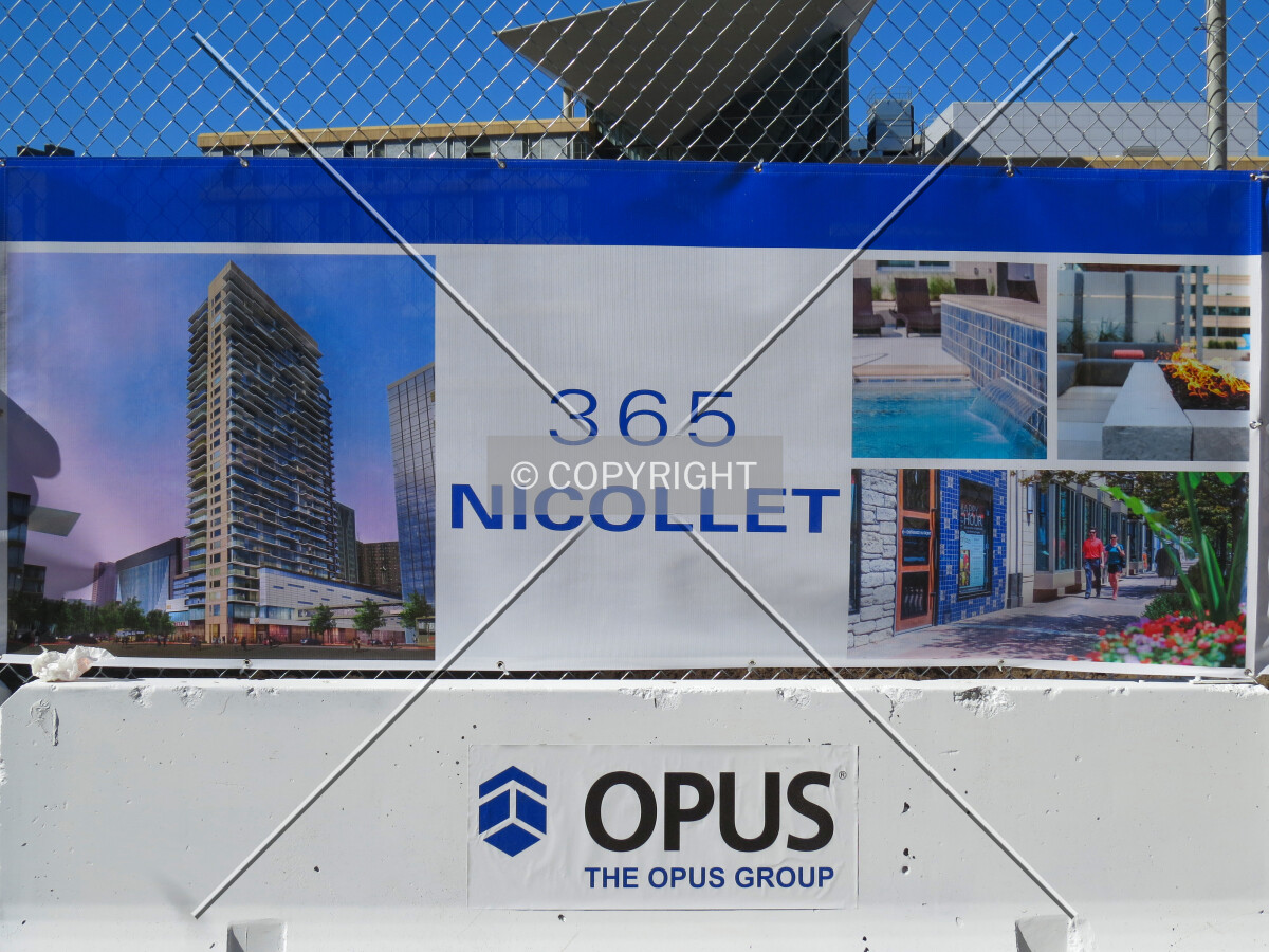 Project renderings on construction banner