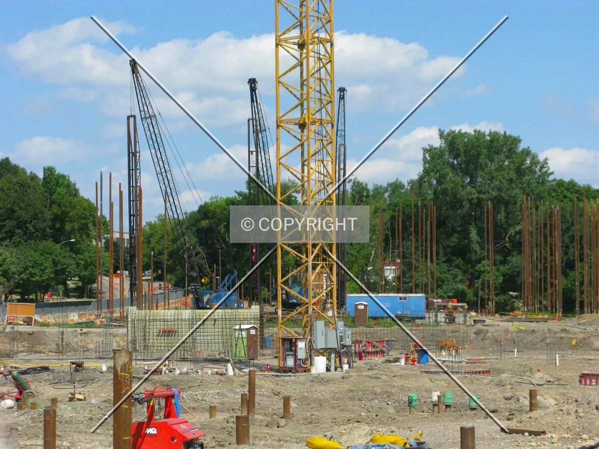 Base of the tower crane with piles for the North Block building in the distance