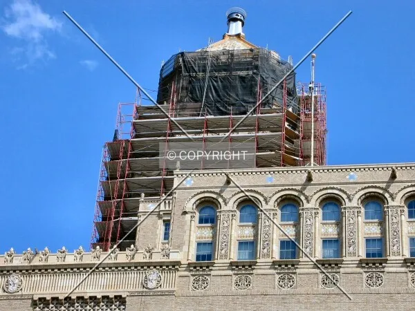 Under scaffolding from 2nd Street SW