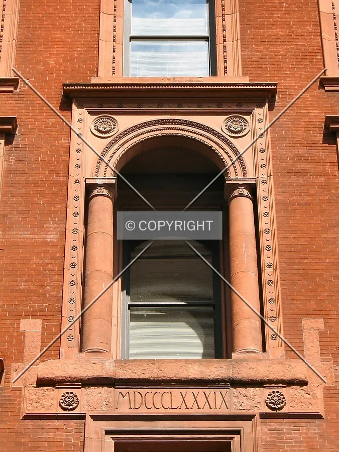 Renaissance-inspired window, with construction date