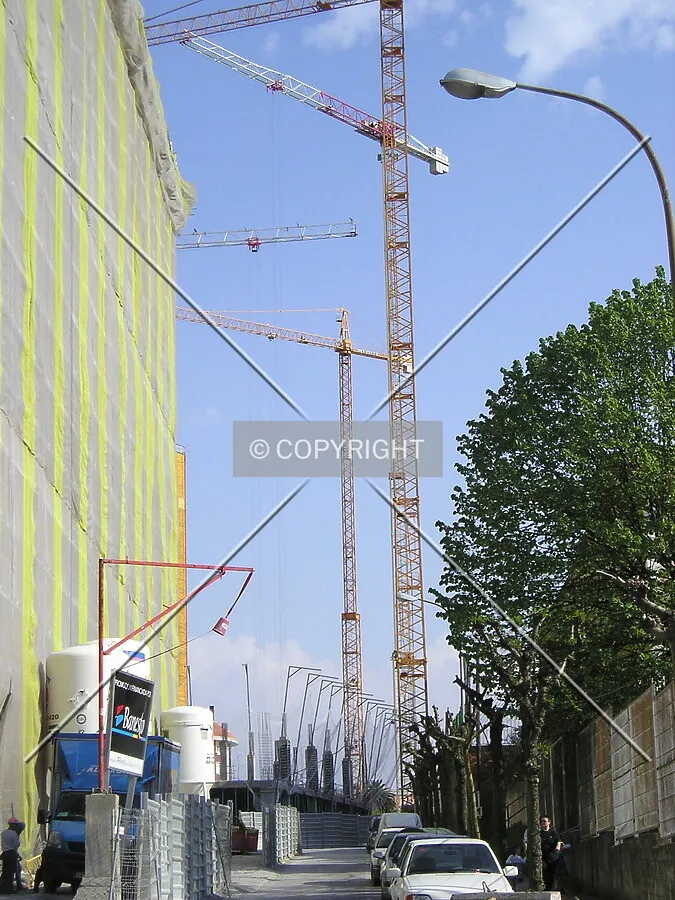 Side view of cranes