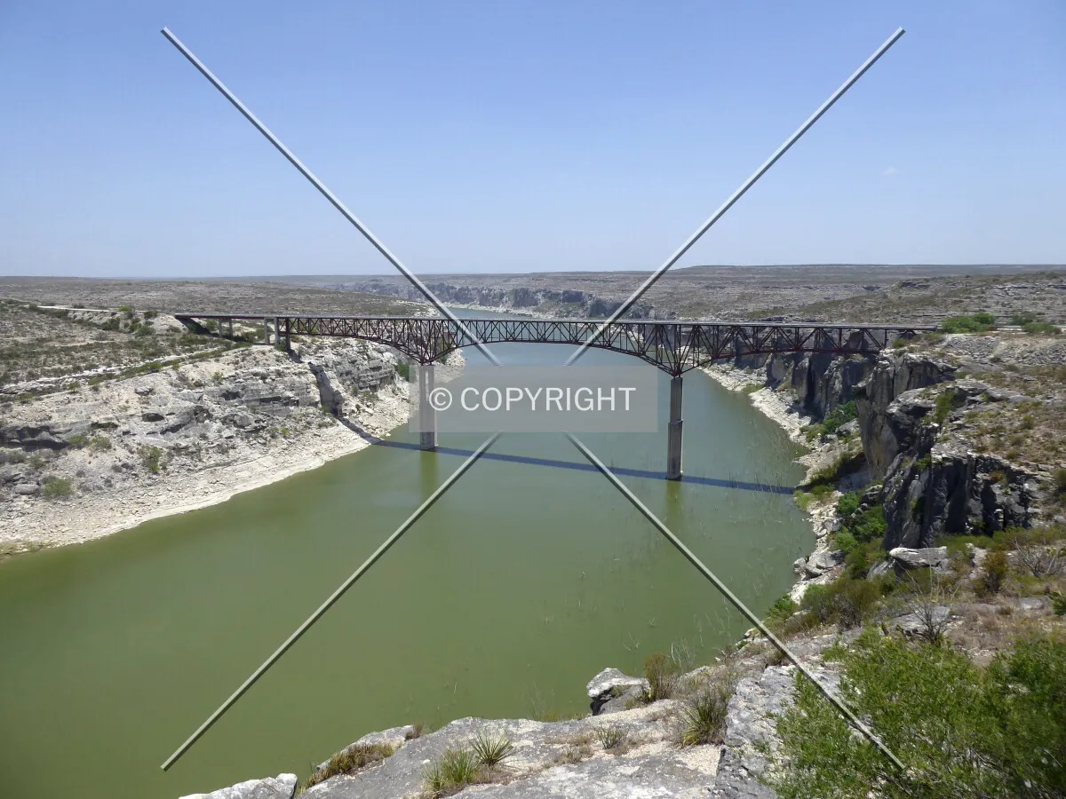 Full span from the south in context with the Pecos River Canyon