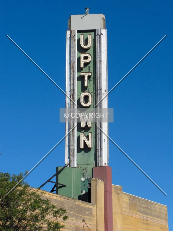 Sign rising over the Uptown neighborhood