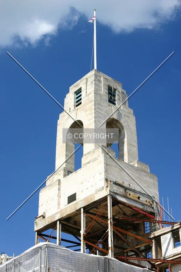 The retained clock tower suspended above the site with some of the original steel frame seen for the first time in around 80 years