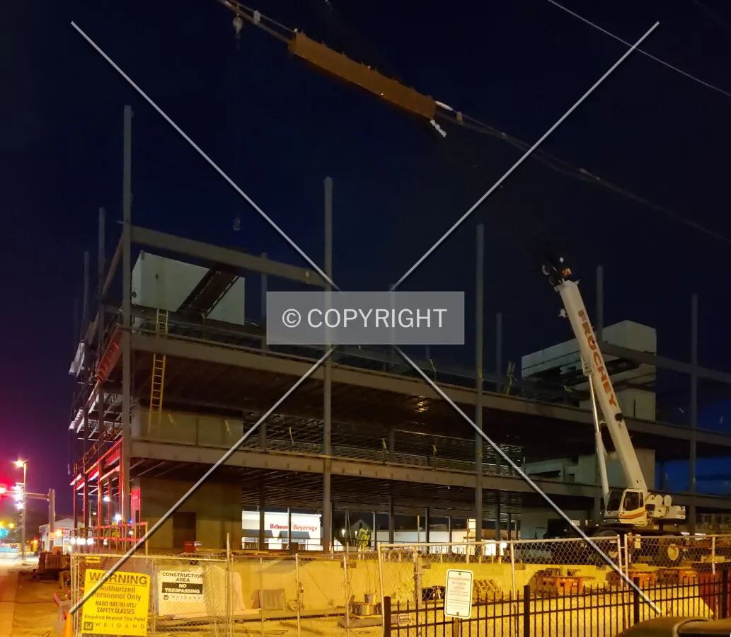 Night view from the southwest during construction; August 10, 2019
