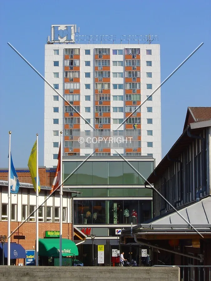 Building rising behind the Huddinge Centrum mall