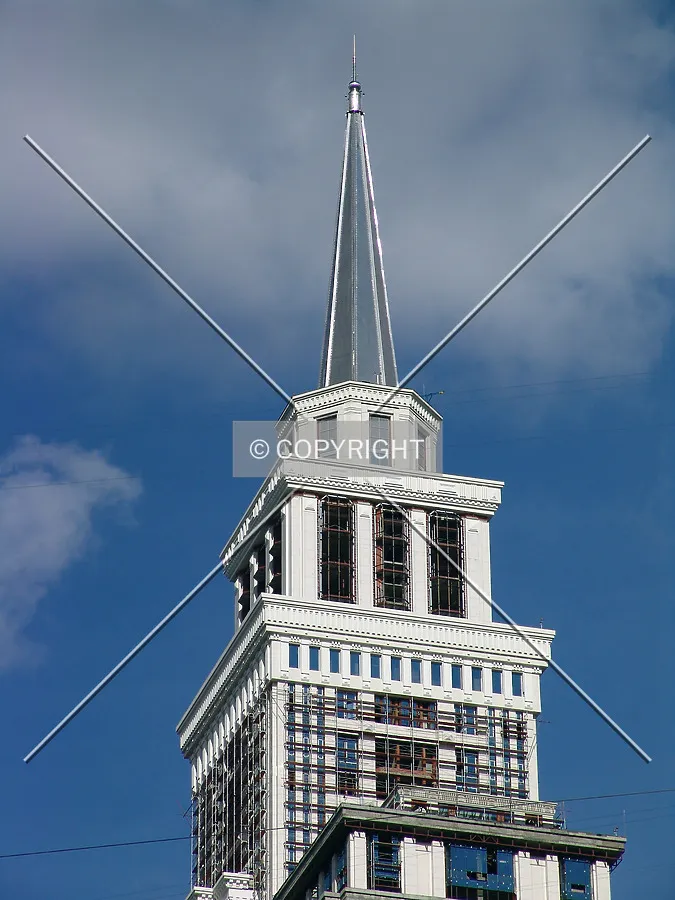 The upper floors and spire as seen from the south