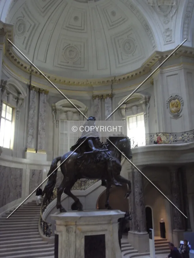 Bronze figure, stairway, and cupola in Bode Museum