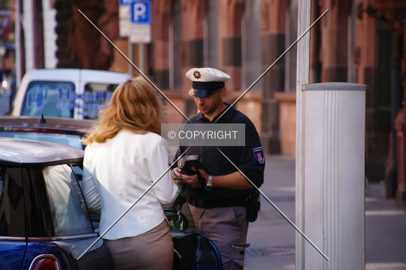 A lady gets a ticket for parking wrongly