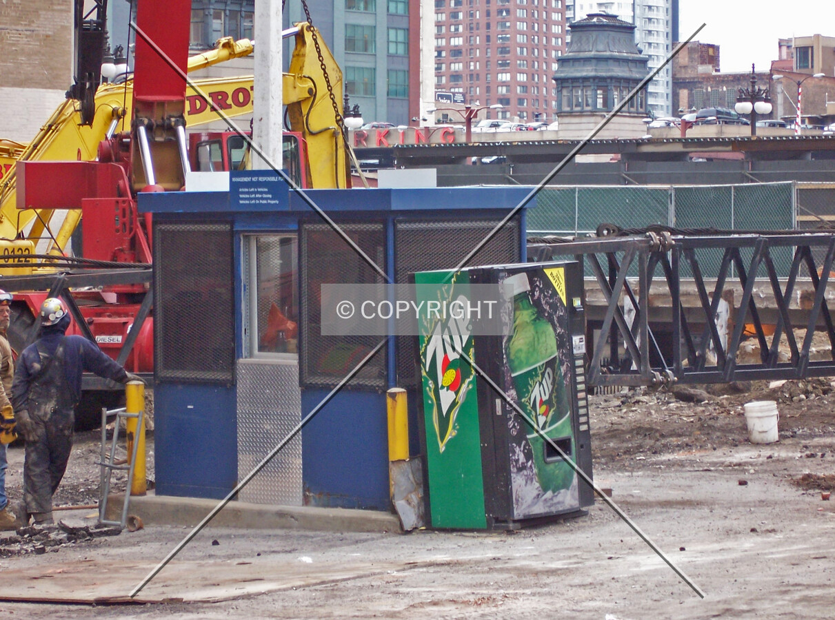 The soon-to-be-removed parking lot attendent both and beverage vending machine