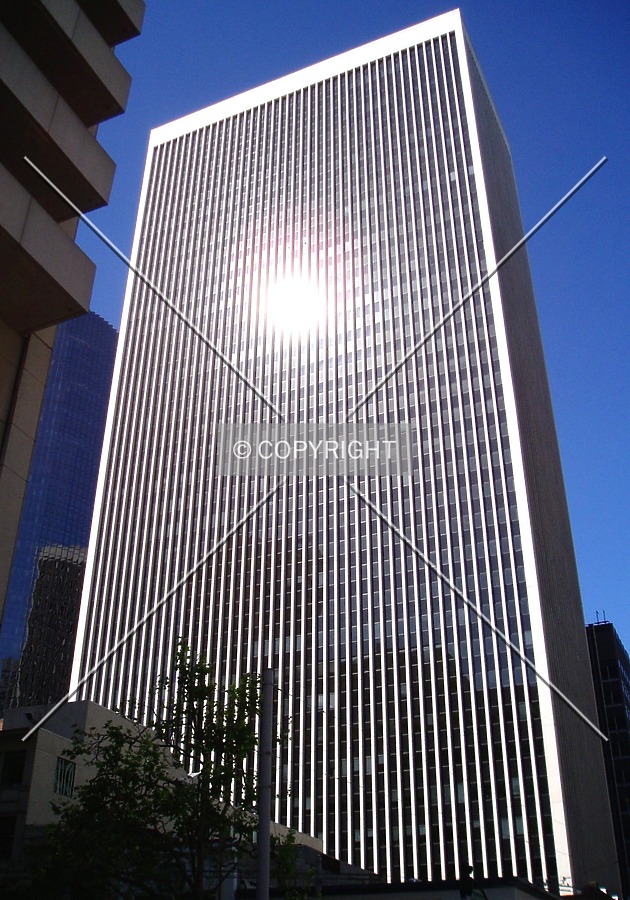 The bright morning sun reflects off the east side