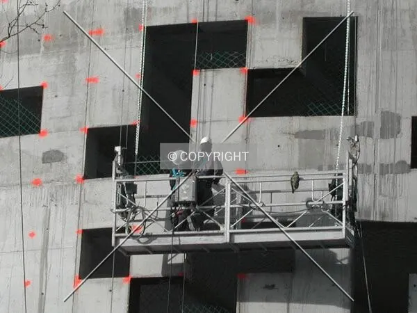 Some workers working on the facade