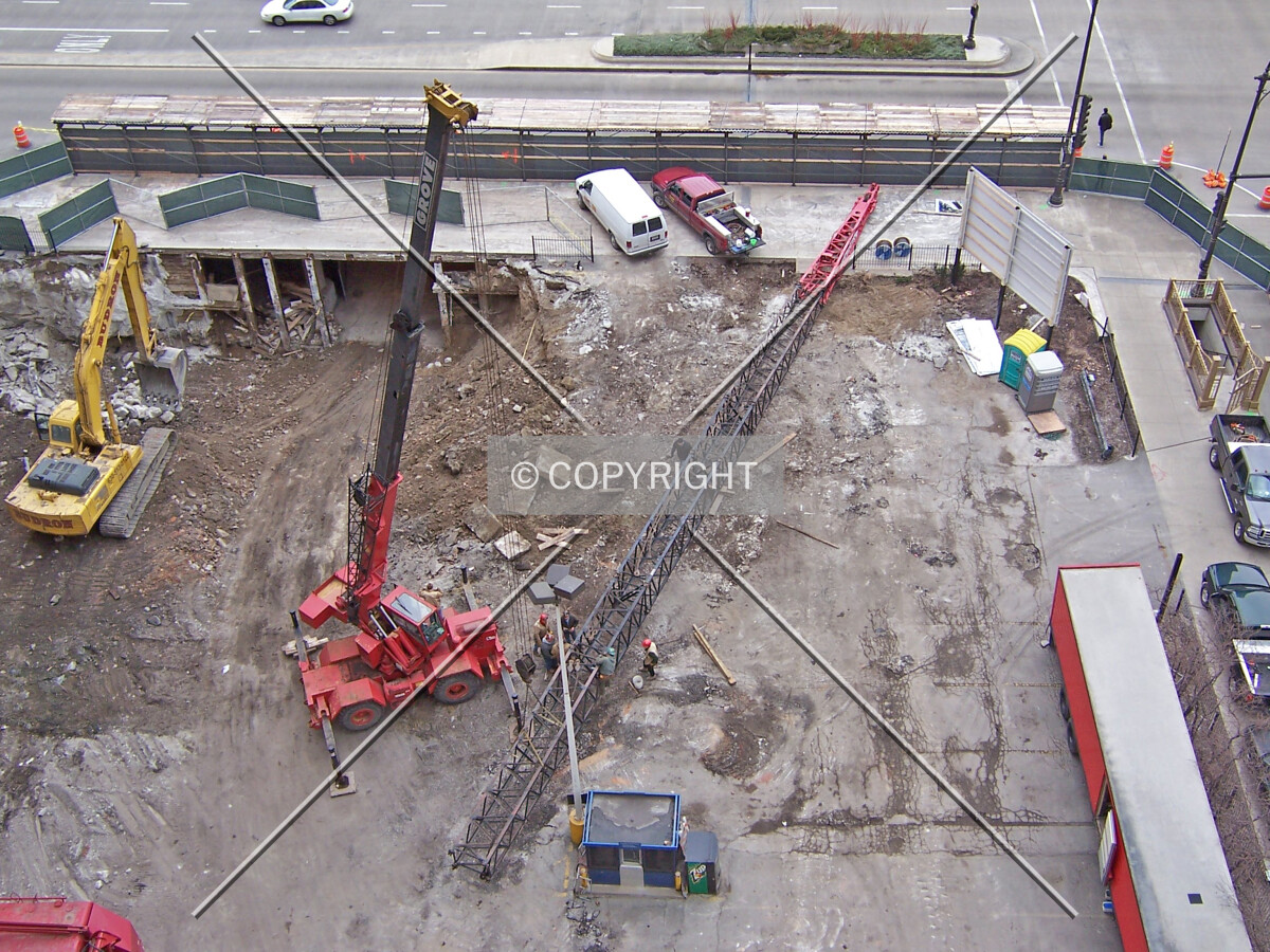 Northeast corner of the site; the boom of the pile driving crane is under assembly