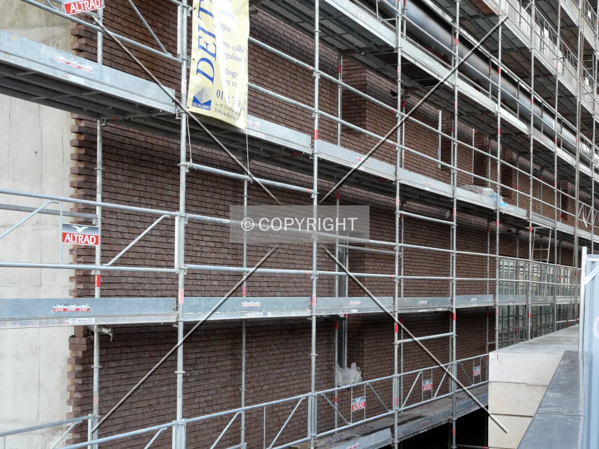 Brick cladding in progress on the north side