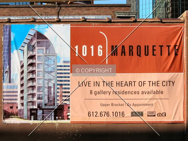 Promotional banner on building to be demolished for new construction