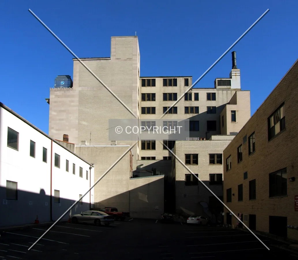 View from the west showing floor levels concealed on the front facades