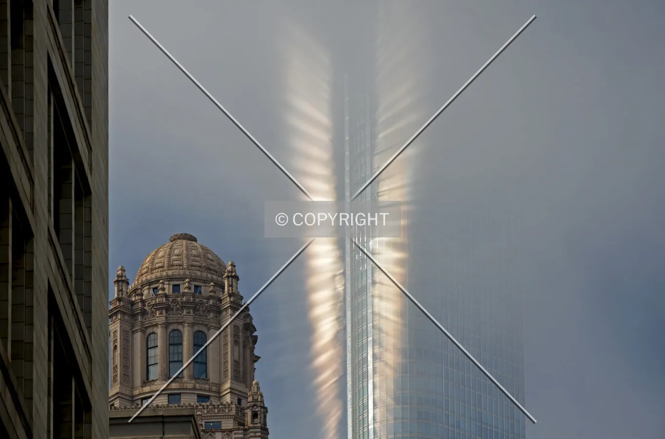 Solar reflections on a foggy day, viewed from North Wabash Avenue, April 28, 2013.