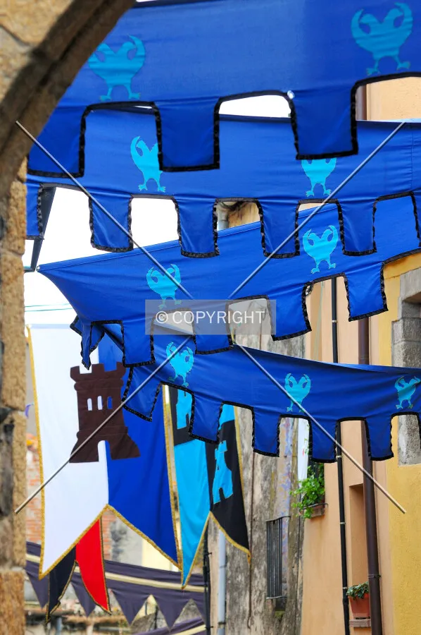 Medieval flags on Hostalric's streets