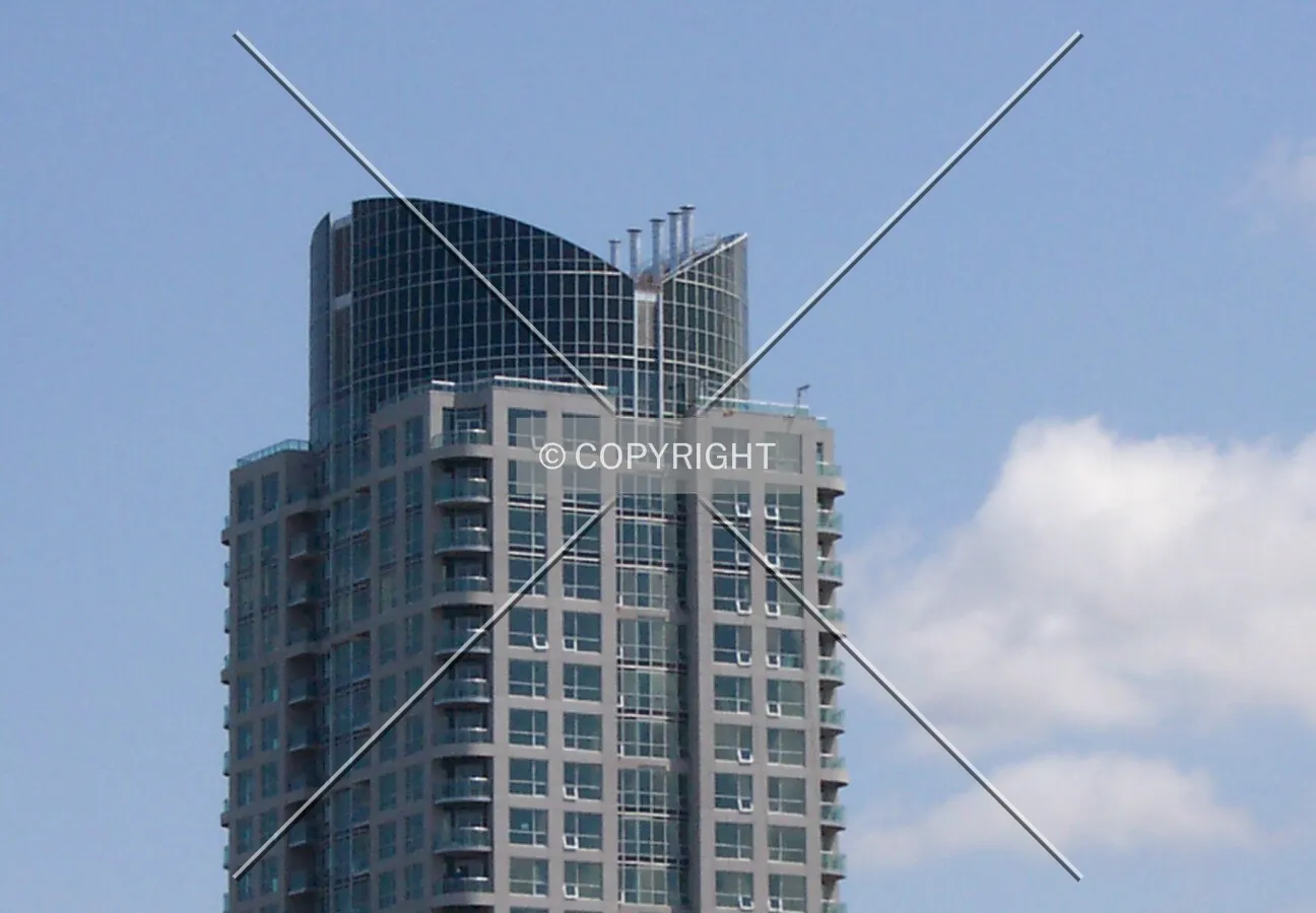 The tower's crown, seen facing east from Churchill Avenue and Scott Street
