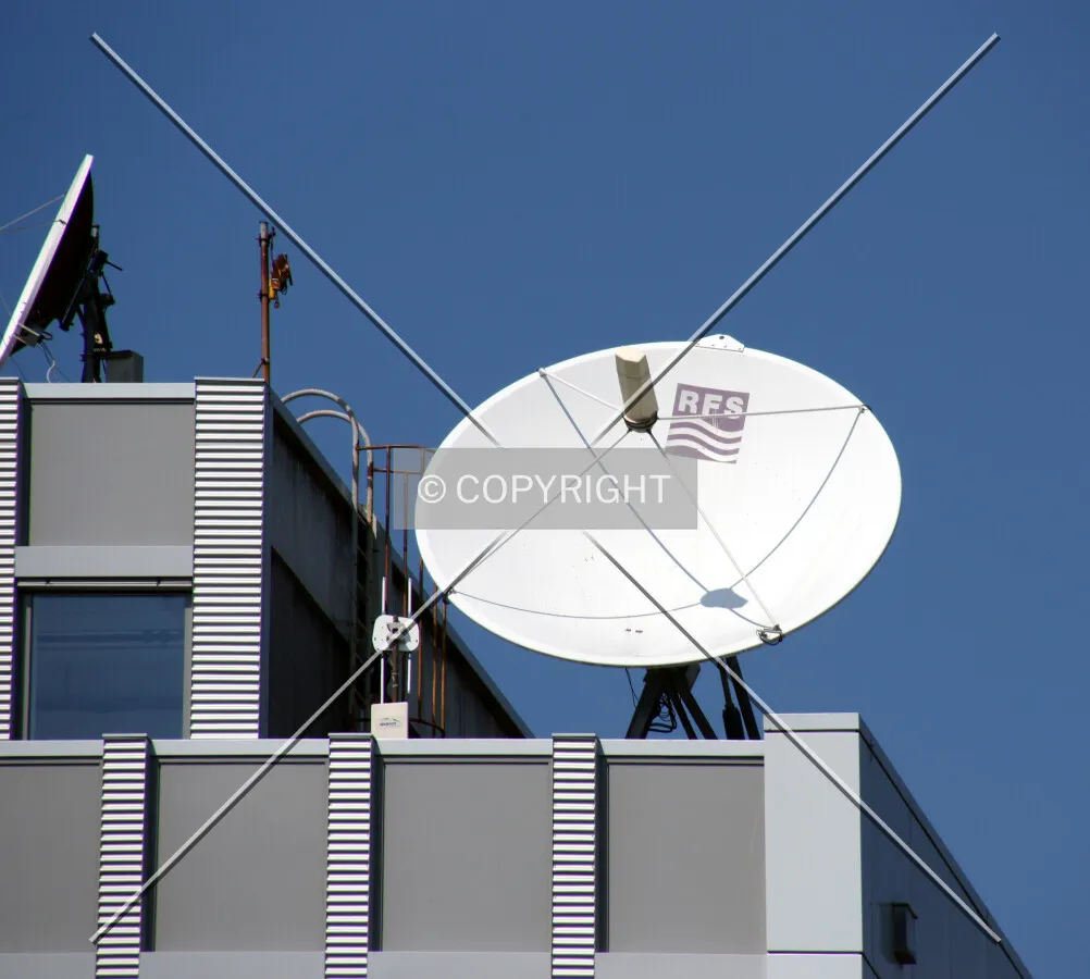 Communication dishes on a building