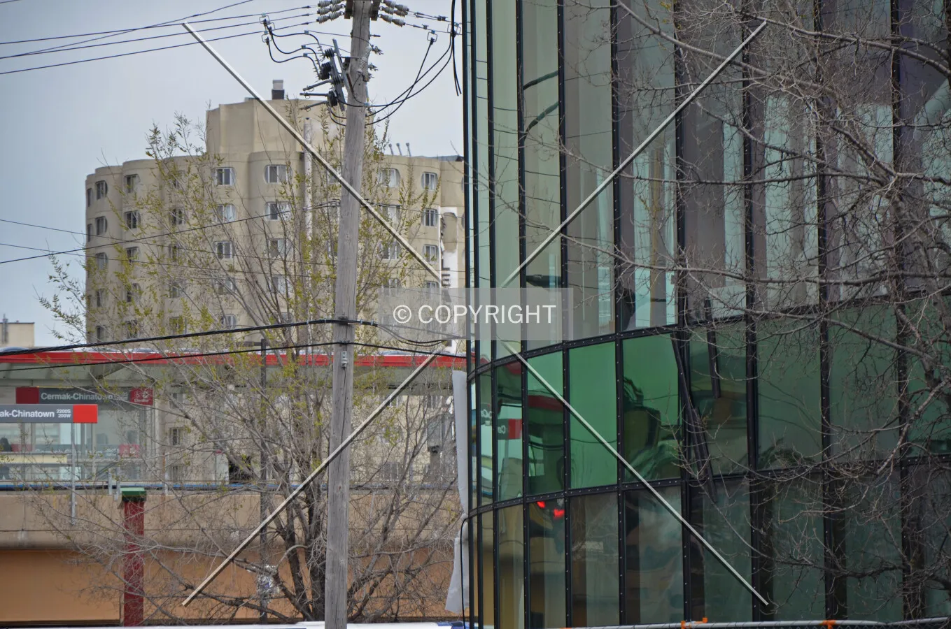 Facade detail, before installation of the vertical fins, contrasting with the Raymond Hillard Center; April 30, 2015.