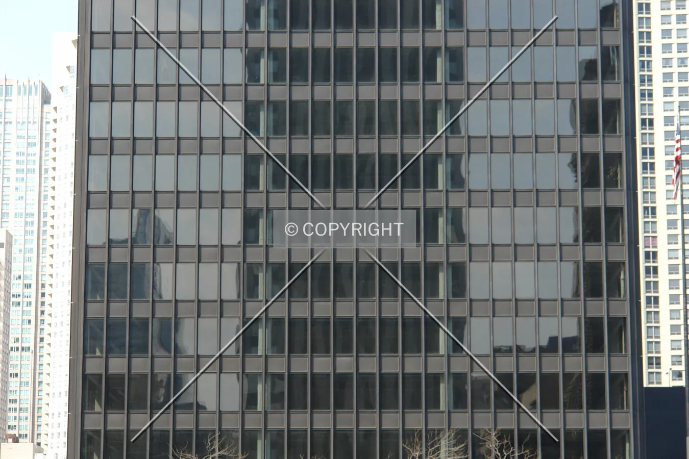 Structural details and floors shining through the glass facade