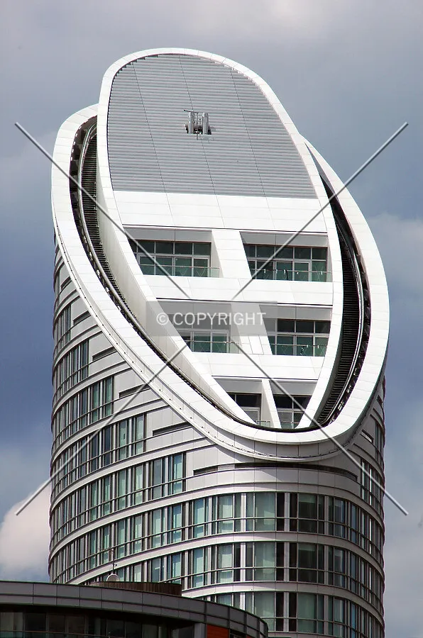 The tower's raking elliptical crown