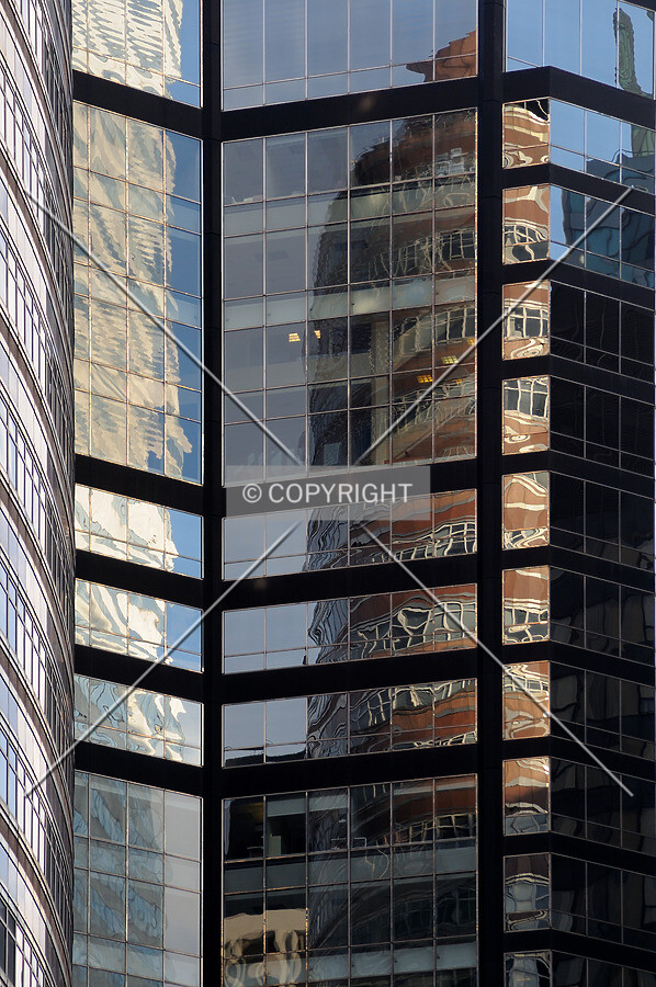 Lipstick Building reflected in the glass