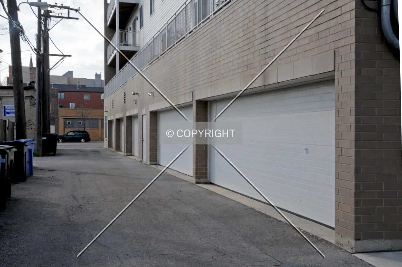 Garage doors along the mid-block alley to the south. March 21, 2012.