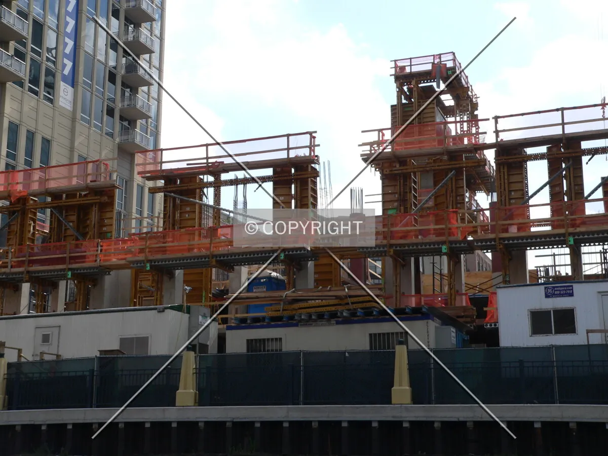 Formwork surrounding freshly poured concrete columns