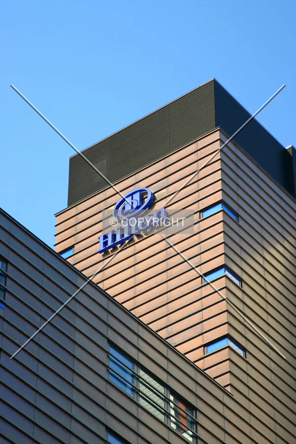 Towards the top from Tooley Street at the hotel logo and the copper flashing showing varying degrees of oxidisation