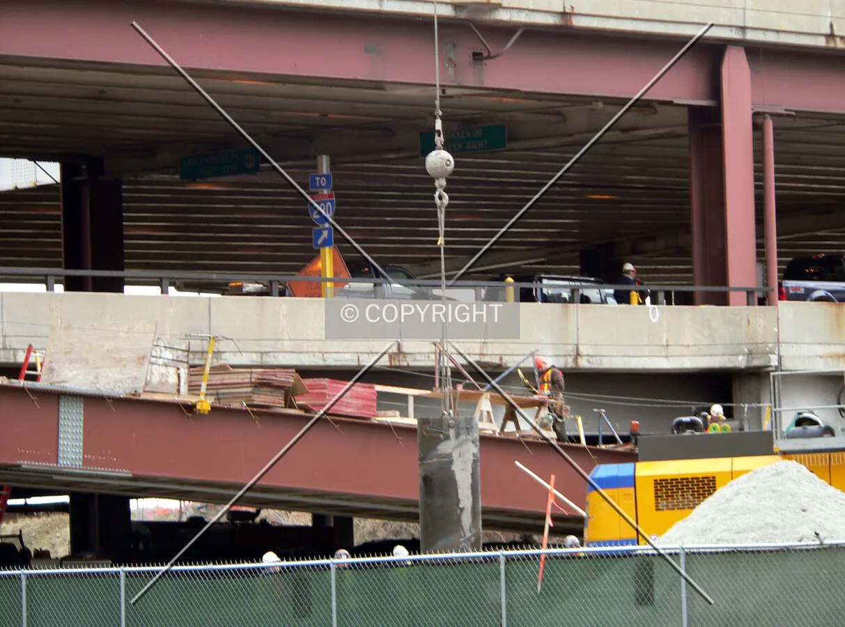 Lowering a caisson tube into the earth