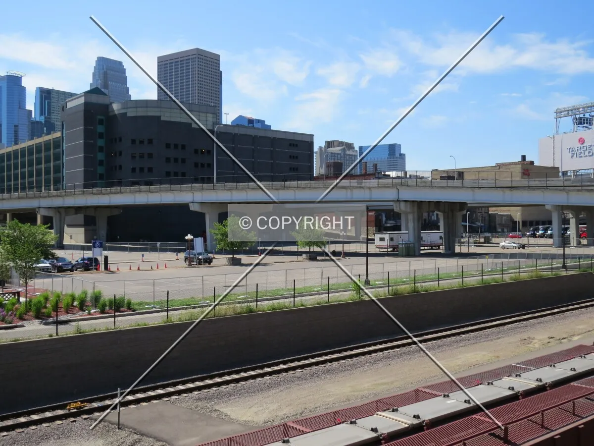 Staking out the site from 3rd Street North across the Cedar Lake Trail and railroad tracks