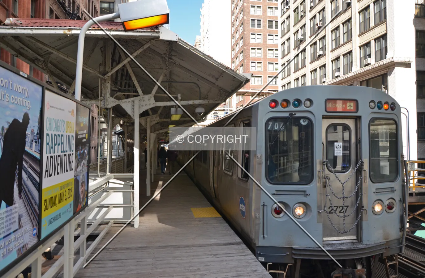 Looking north on the western platform beside an Orange Line train; March 7, 2015.