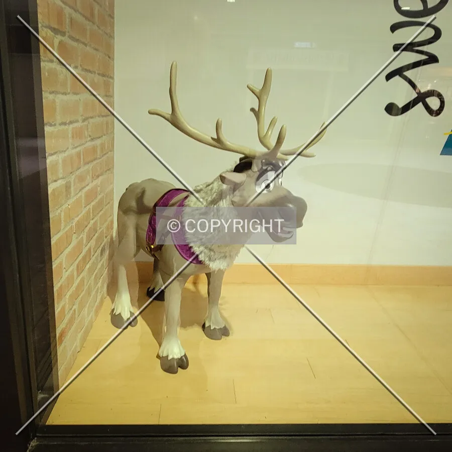 Statue of Sven from the Frozen movie in a store window; October 28, 2023