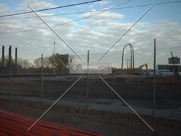 Twilight view of the excavation, looking northeast across the construction site