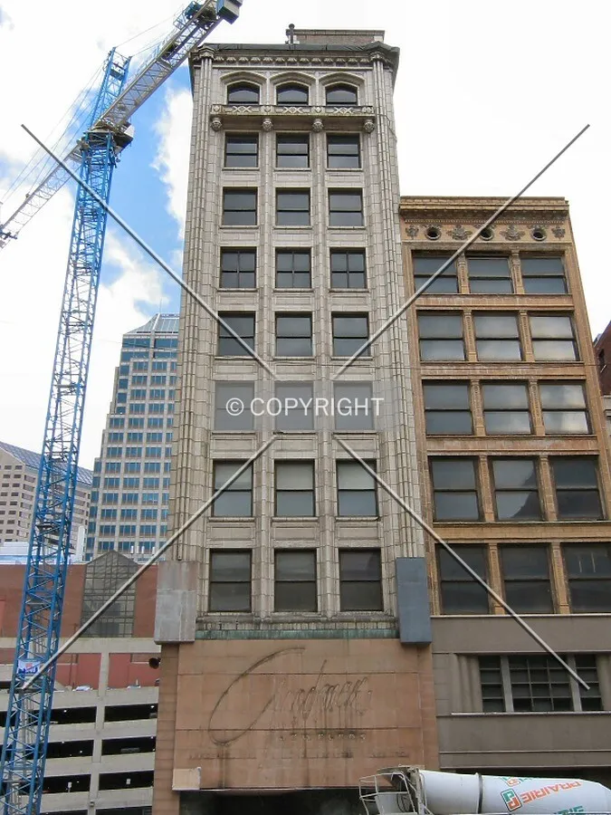 Looking up from across Washington Street, Conrad tower crane in background