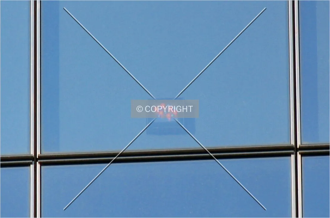 Colored lights installed behind each glass panel of the facade
