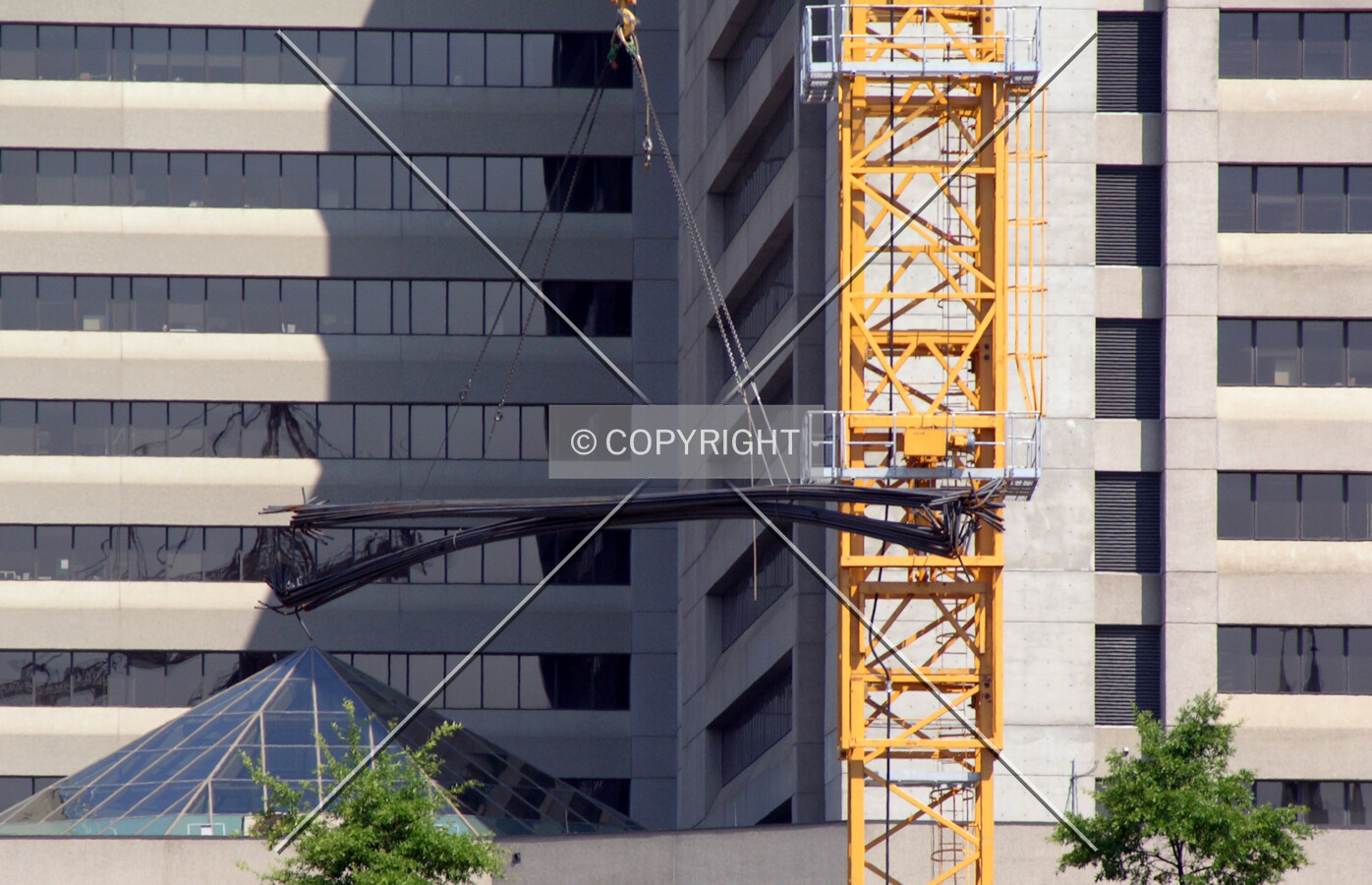 Rebar descending into the building pit
