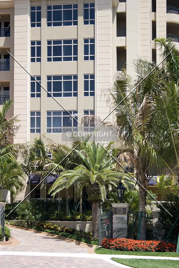 Entry drive, sign and west facade